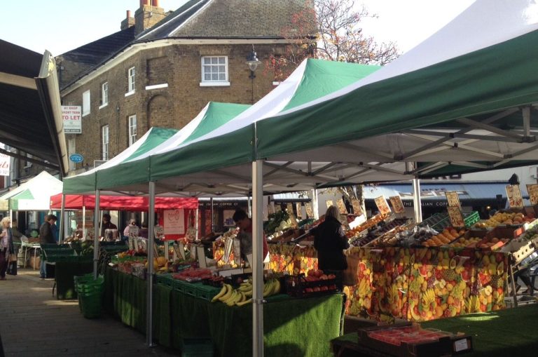 Farmers Markets Return to City Centres in Force A farmers market stall with vegetables