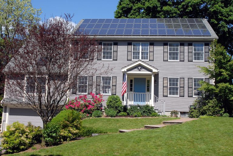 The Household Energy Savings That Actually Work A modern home with solar panels on the roof