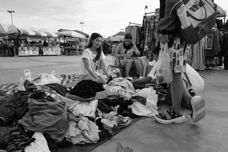 Second-Hand Marketplaces Have Gone Mainstream Clothes rails in a second-hand charity shop